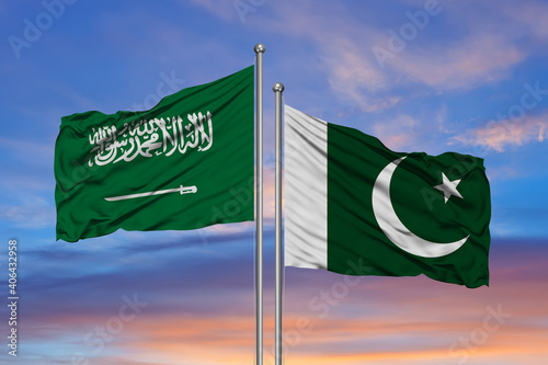 Saudi Arabia and Pakistan, two flags waving against blue sky. 3d image