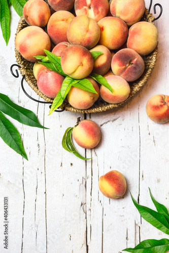Ripe juicy peaches on a rustic background