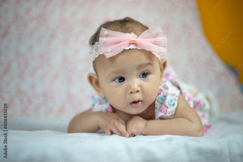 3 Month Old Asian Baby Girl Holding her head up at 45 degrees Child Development 3 month old baby girl 3 Month Old Asian Baby Girl Holding her head up at 45 degrees Child Development 3 month old baby girl