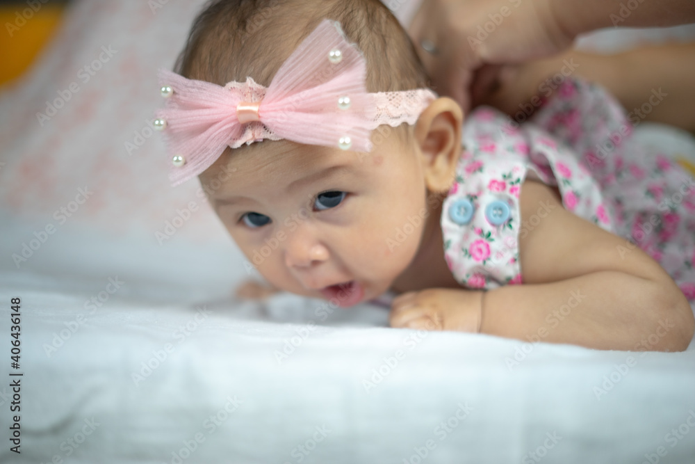 3 Month Old Asian Baby Girl Holding her head up at 45 degrees Child Development 3 month old baby girl 3 Month Old Asian Baby Girl Holding her head up at 45 degrees Child Development 3 month old baby girl