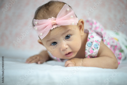 3 Month Old Asian Baby Girl Holding her head up at 45 degrees Child Development 3 month old baby girl