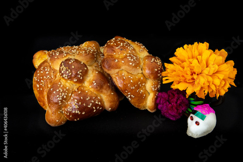 Mexican pan de muerto with cempasuchil and skull, for day of the dead photo