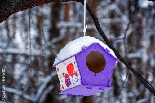 birdhouse made with your own hands in the winter forest