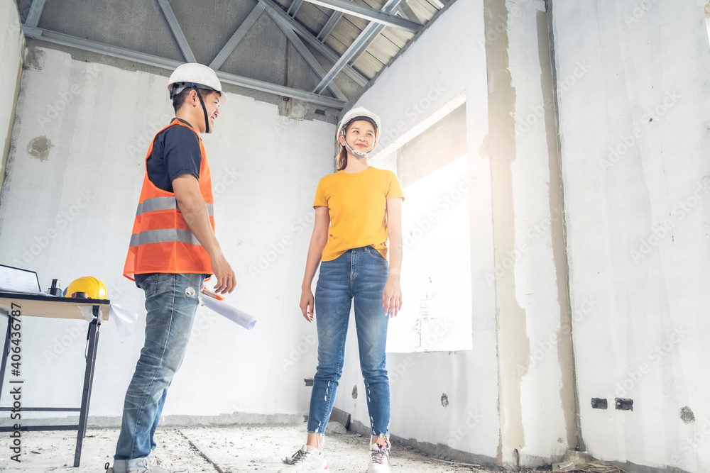 Young asian couple checking house with foreman engineering home inspection building house Walk home inspection with looking and pointing construction for check building home on job site to customers