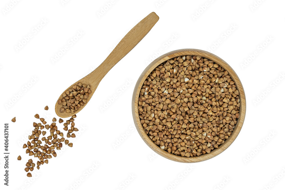 Buckwheat groats in a bowl and wooden spoon isolated on white Buckwheat groats in a bowl and wooden spoon isolated on white