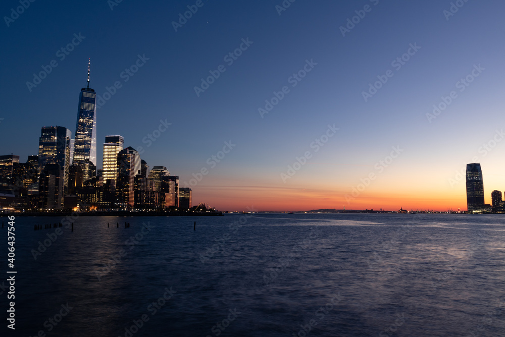 Dusk on the Hudson River between the New York City and Jersey City Skyline after a Sunset