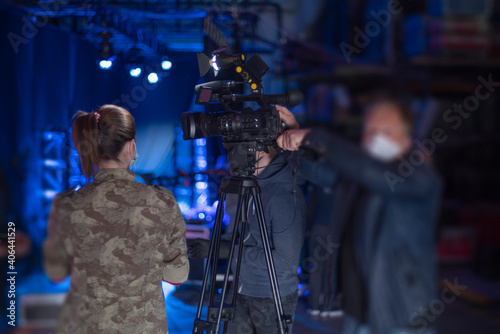 masked journalists interviewing during a pandemic.