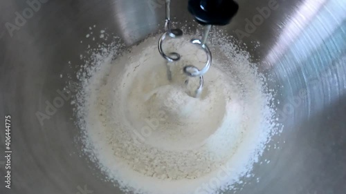 Mixing flour ingredient in stand mixer for making bakery, bread and cake. Prepare dough for baking with flour mixing machine.