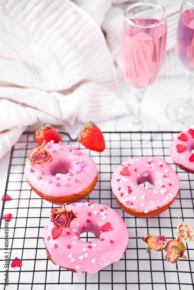 Pink doughnuts on the baking rack. Valentine's Day concept. Pink doughnuts on the baking rack. Valentine's Day concept.