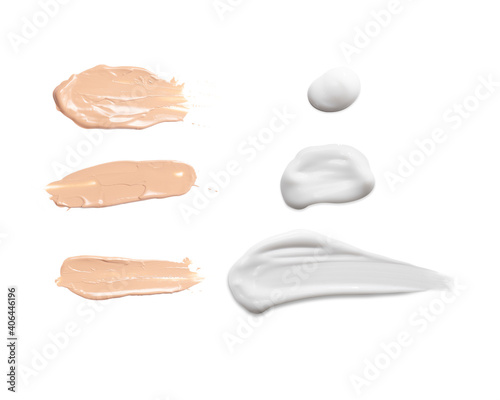 White cream and foundation texture swoosh swatch sample cosmetics isolated on white background