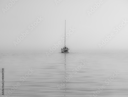 sailboat in the sea. mist