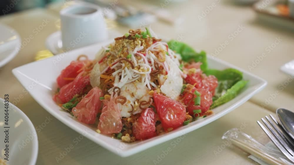 Healthy Serving Of Pomelo Salad Appetizer For Sharing At A Restaurant - close up shot Healthy Serving Of Pomelo Salad Appetizer For Sharing At A Restaurant - close up shot