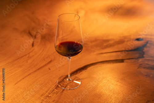 Glass of red wine on a wooden table