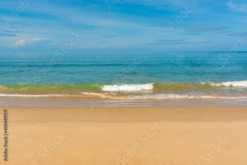 View of blue sky  blue sea  small wave and yellow sand that is signature of beautiful seascape scene at Phuket Province  Thailand in the morning of holiday.