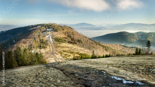Shelter at Mt Klimczok at dusk during early winter, with Mt Babia Góra and the Tatras in the background, Silesian Beskids, Poland