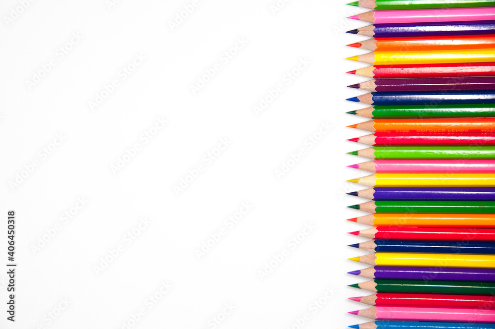 Mixed arranged of rainbow colors wooden pencils on white background Mixed arranged of rainbow colors wooden pencils on white background