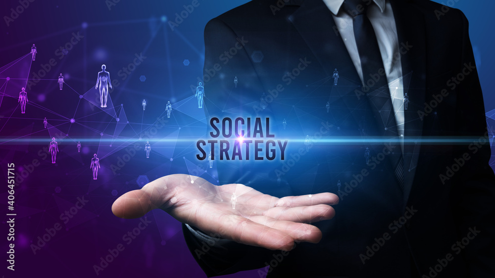 Elegant hand holding SOCIAL STRATEGY inscription, social networking concept Elegant hand holding SOCIAL STRATEGY inscription, social networking concept