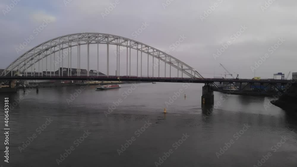 Aerial shot of arch bridge over Noord River in netherlands. Slow motion. Aerial shot of arch bridge over Noord River in netherlands. Slow motion.