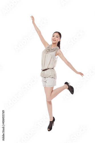 Portrait of a Young woman jumping smiling