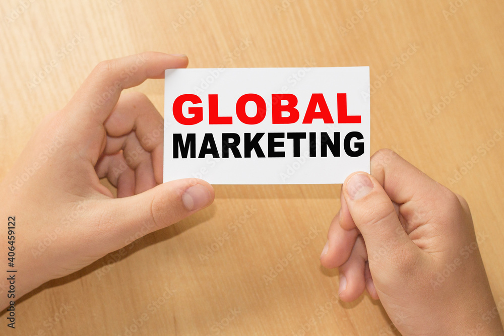 Card with text GLOBAL MARKETING on hands. You can use in business, marketing and other concepts. Messege of the day. Card with text GLOBAL MARKETING on hands. You can use in business, marketing and other concepts. Messege of the day.