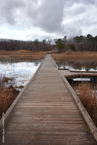 Long wooden bridge over flooded ground waters © Thomas