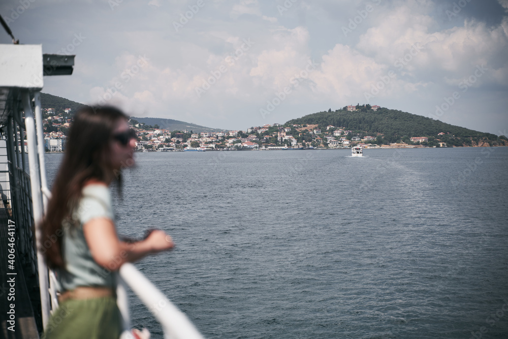 Young long haired girl on sea ship. Relaxation during summer vacation Young long haired girl on sea ship. Relaxation during summer vacation