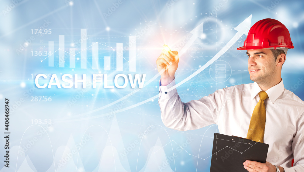Young businessman with helmet drawing CASH FLOW inscription, modern business technology concept Young businessman with helmet drawing CASH FLOW inscription, modern business technology concept