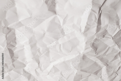 Crumpled white paper background.