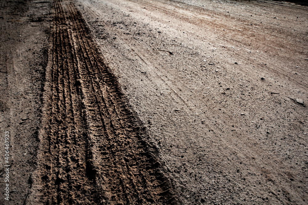 Tyre track on dirt sand or mud, Picture in retro or grunge tone. Car drive on sand. off road track. Track on grass field. Track in farm. Tyre track on dirt sand or mud, Picture in retro or grunge tone. Car drive on sand. off road track. Track on grass field. Track in farm.