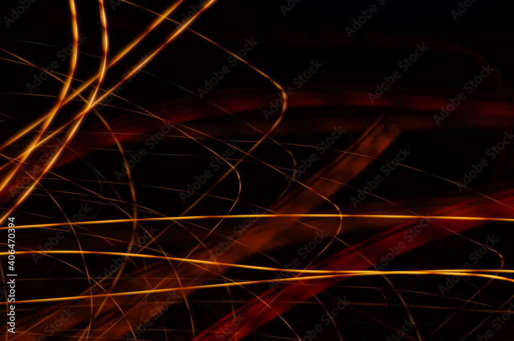 Luminous streamer - neon bright lines on black background.