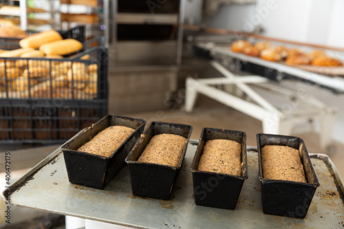 Fresh bread in a metal bread pan closeup