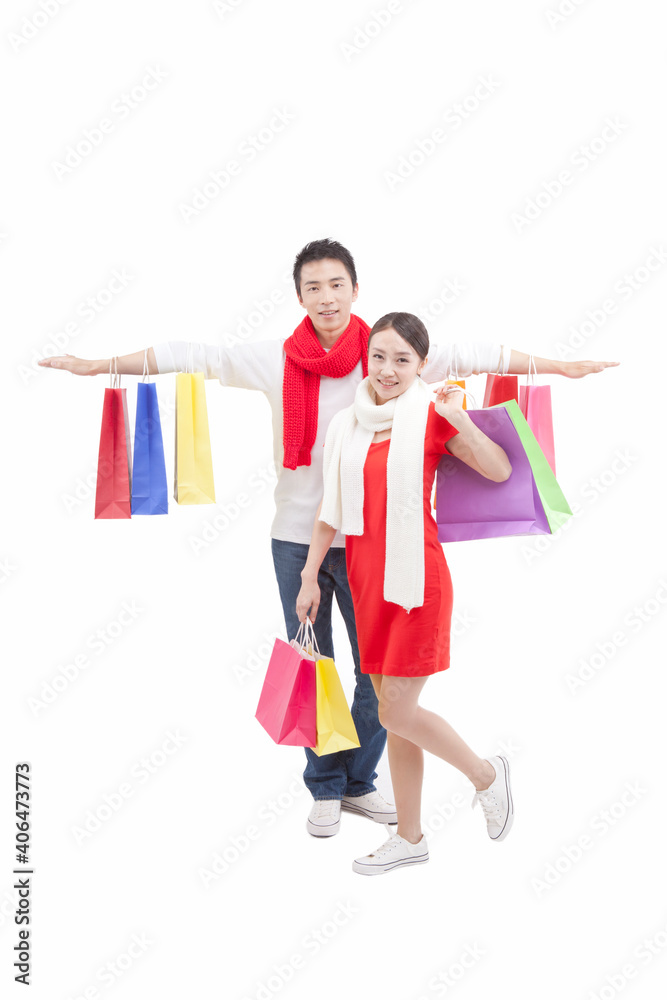 Portrait of wife holding shopping bags over shoulder Portrait of wife holding shopping bags over shoulder