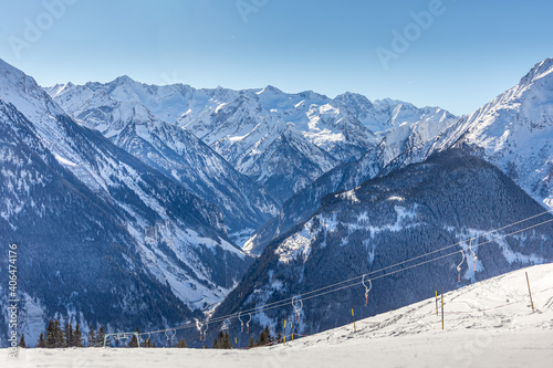 Empty drag lifts on snowy mountain - empty ski field