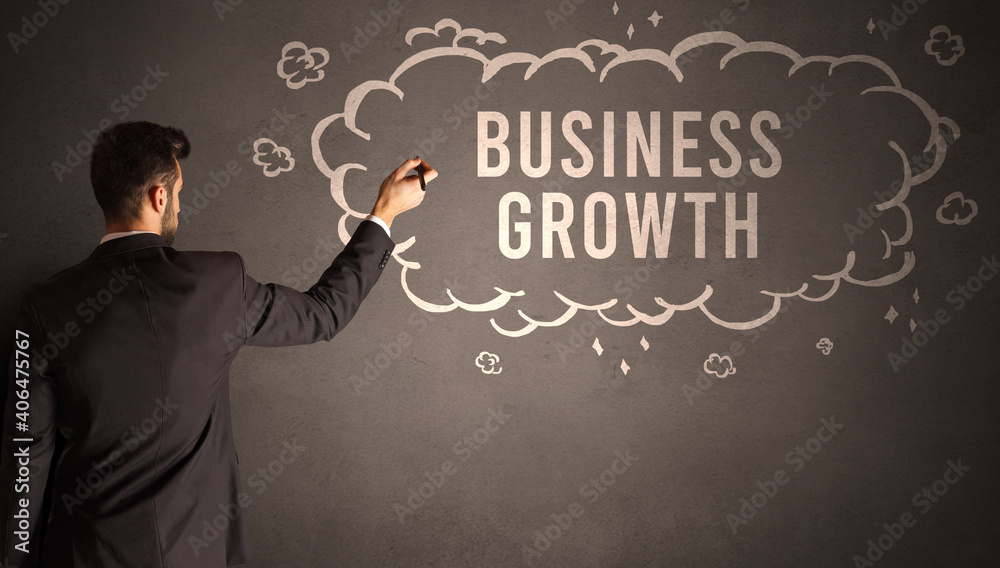 businessman drawing a cloud with BUSINESS GROWTH inscription inside, modern business concept businessman drawing a cloud with BUSINESS GROWTH inscription inside, modern business concept