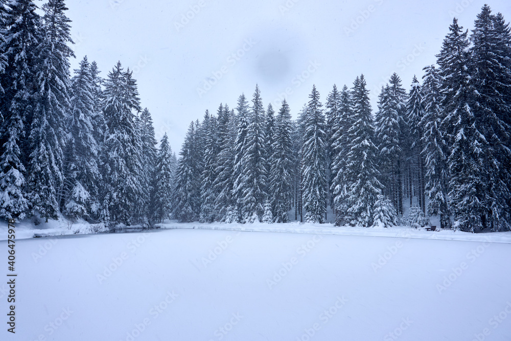 an icy mountain lake in a beautiful winter landscape an icy mountain lake in a beautiful winter landscape