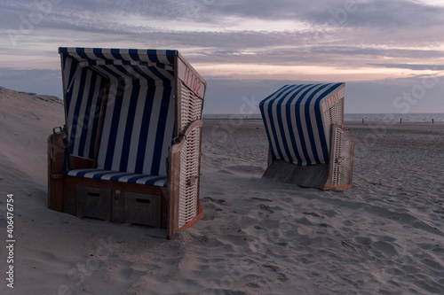 beach chairs in the sunset on Norderney island at the North Sea  Germany