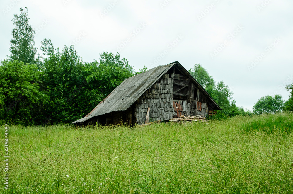 abandoned house in a village beyond the hills . abandoned house in a village beyond the hills .