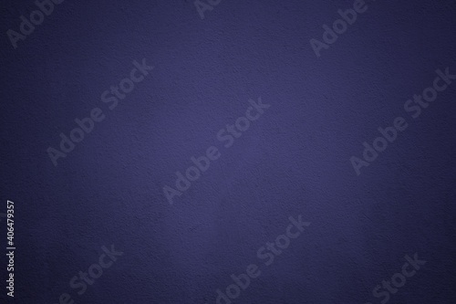 Blue Grunge Concrete Wall Texture Background with Spotlight at the Center.