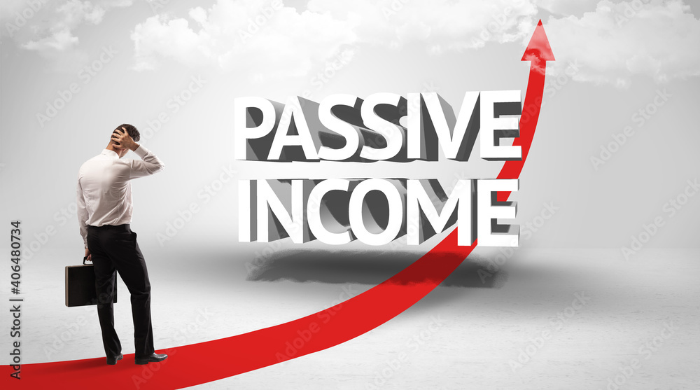 Rear view of a businessman standing in front of PASSIVE INCOME inscription, successful business concept Rear view of a businessman standing in front of PASSIVE INCOME inscription, successful business concept