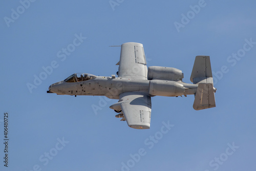 A-10A tank buster jet flying against a blue sky near Las Vegas.  photo