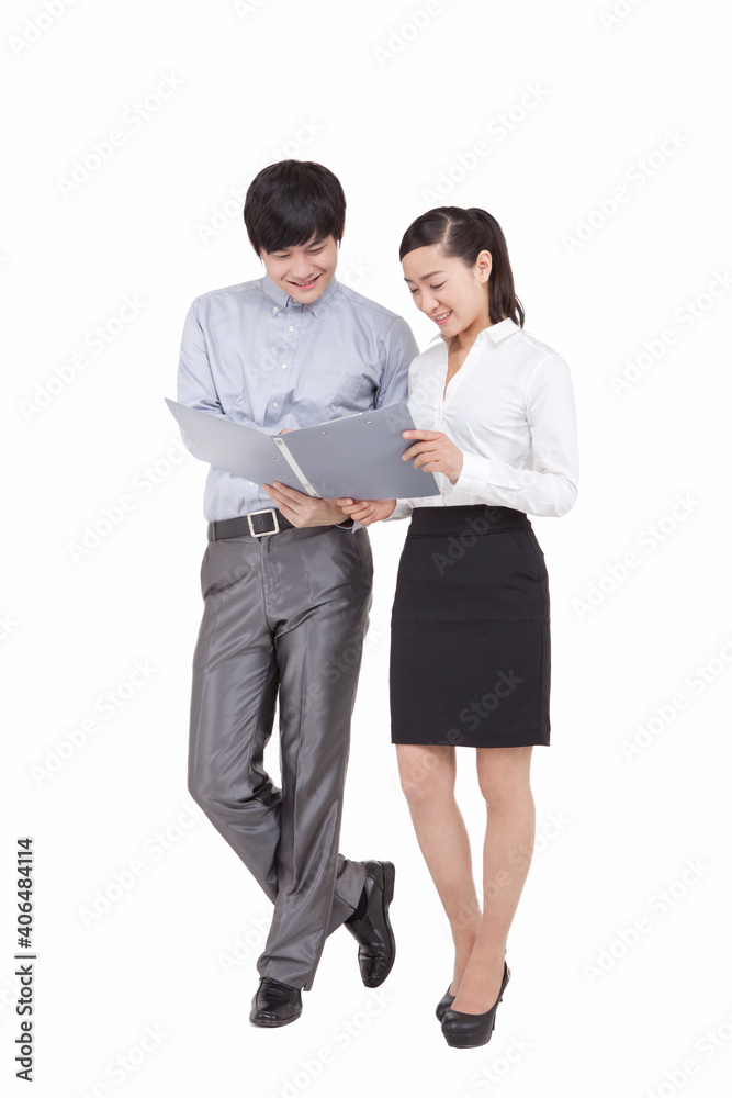 Portrait of businessman and businesswoman looking at folders Portrait of businessman and businesswoman looking at folders