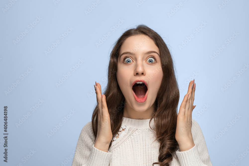 Close up portrait of beautiful darkhaired woman spreading hands, standing isolated over background, astonished female with widely opened mouth wearing ssweater. People emotions concept. Close up portrait of beautiful darkhaired woman spreading hands, standing isolated over background, astonished female with widely opened mouth wearing ssweater. People emotions concept.
