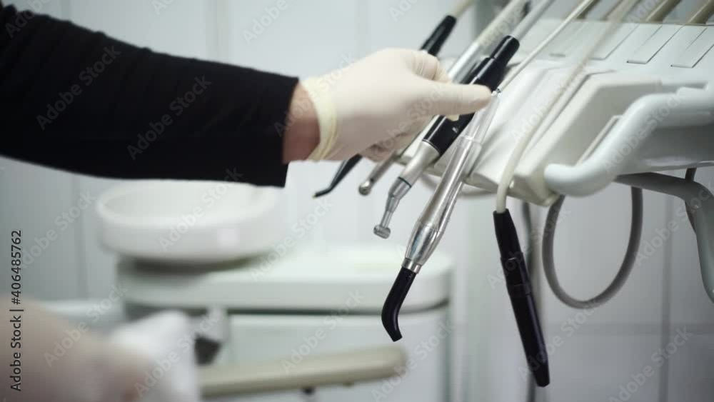 Dentist Disinfecting Dentistry Tools. Doctor Hands Preparing Dental Equipment for next tooth meshing. Close up. Dentist Disinfecting Dentistry Tools. Doctor Hands Preparing Dental Equipment for next tooth meshing. Close up.