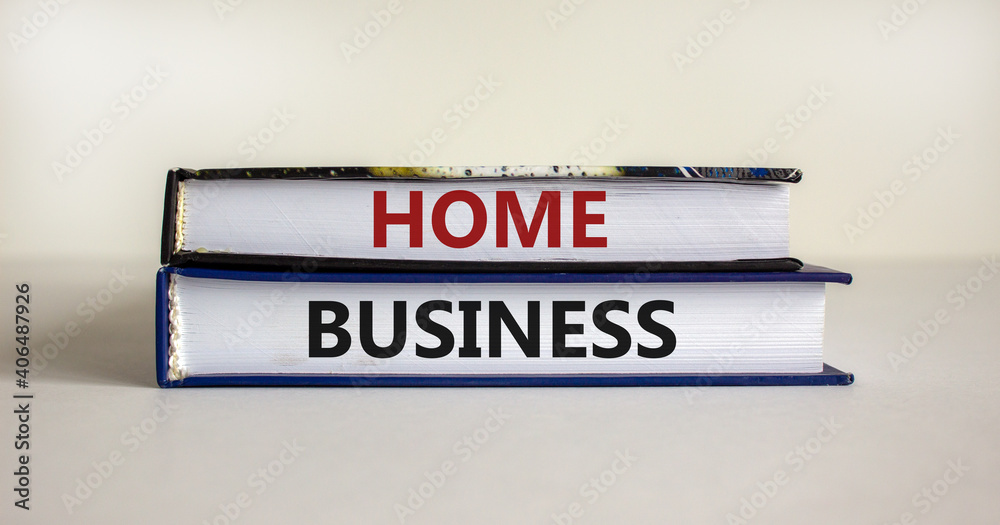 Home business symbol. Books with words 'home business' on beautiful white table. White background. Business and home business concept. Copy space.