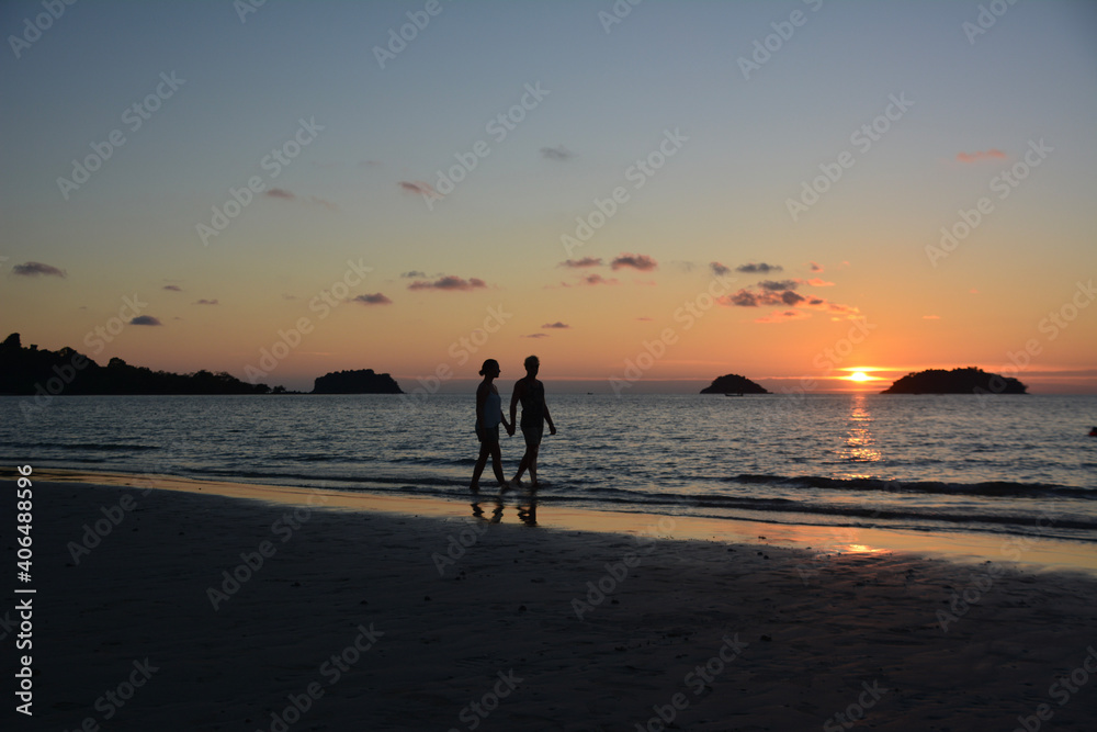 couple during sunset on the beach on Koh Chang, Thailand