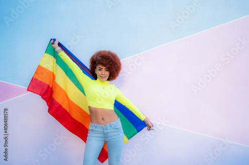 gorgeous woman with afro hair showing lgtbi flag photo