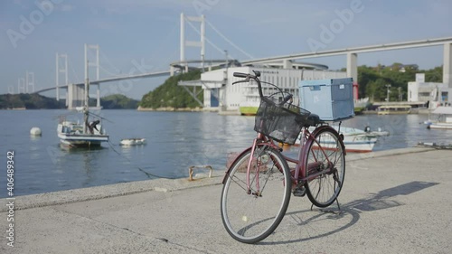 Rental Bike and Nishiseto Expressway in Background on Shimanami Kaido, Japan photo