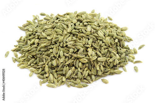 Heap of fennel seeds against white background