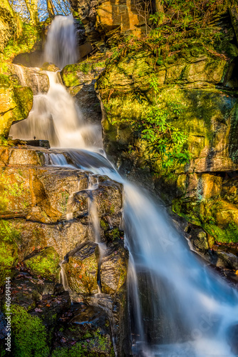 A long exposure view of  an upper waterfall cascade at Lumsdale on Bentley Brook  Derbyshire  UK