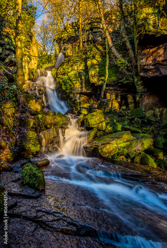 A long exposure panorama view of an upper waterfall cascade at Lumsdale on Bentley Brook, Derbyshire, UK